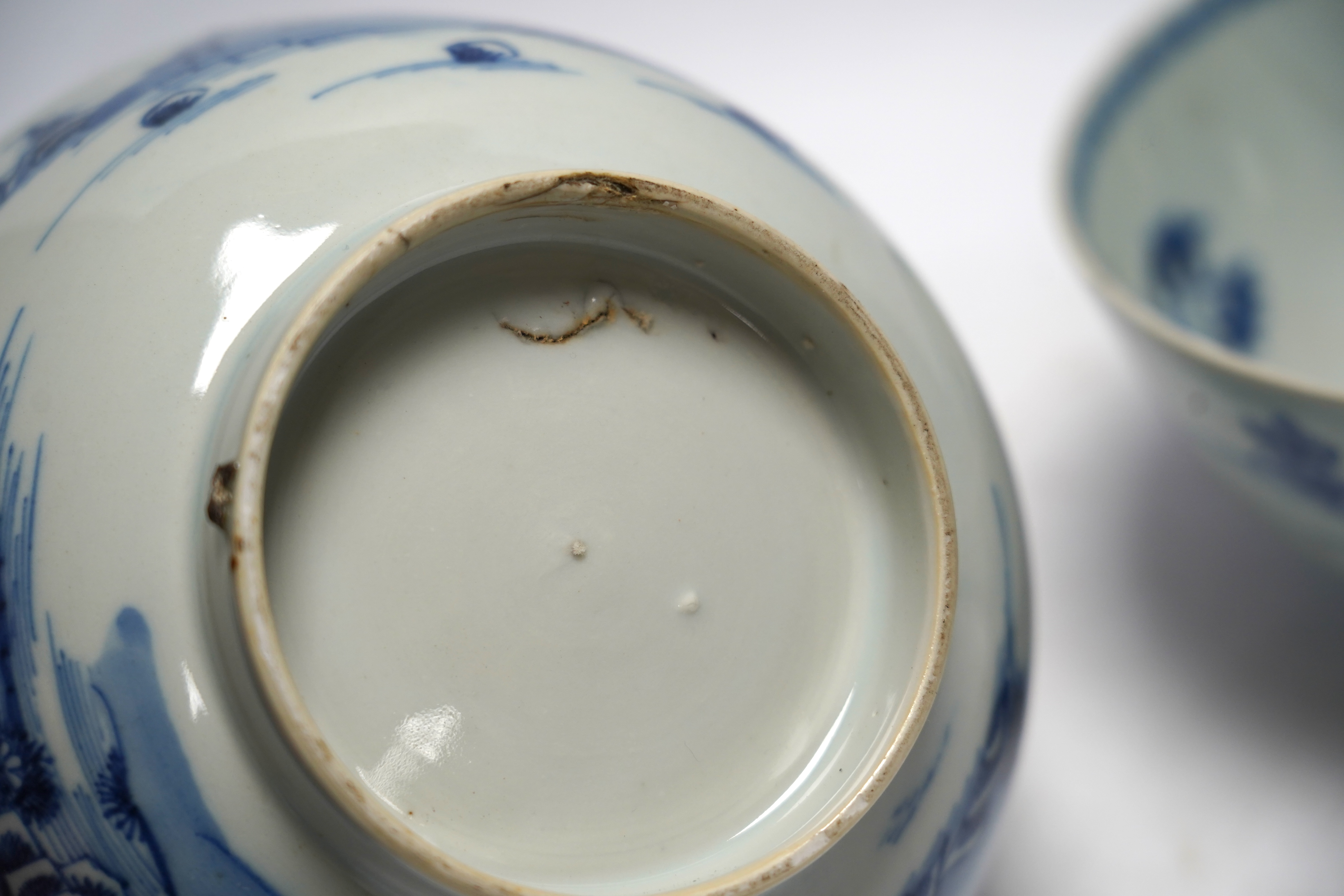 A group of 18th century Chinese and Japanese porcelain including blue and white bowls and jar with hardwood cover, largest 19cm in diameter